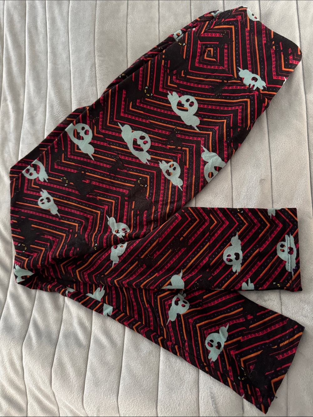 LuLaRoe Black Leggings with Red, Pink & Light Blue Ghost Print
